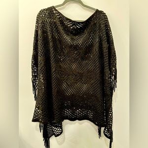Fringed knit poncho. Black with metallic thread.